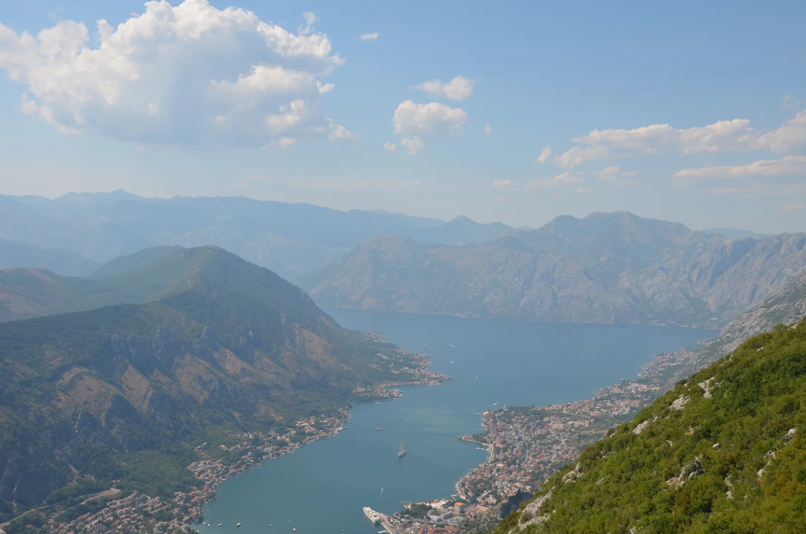 The deep blue Bay of Kotor winding between mountains, seen from the heights above Kotor.