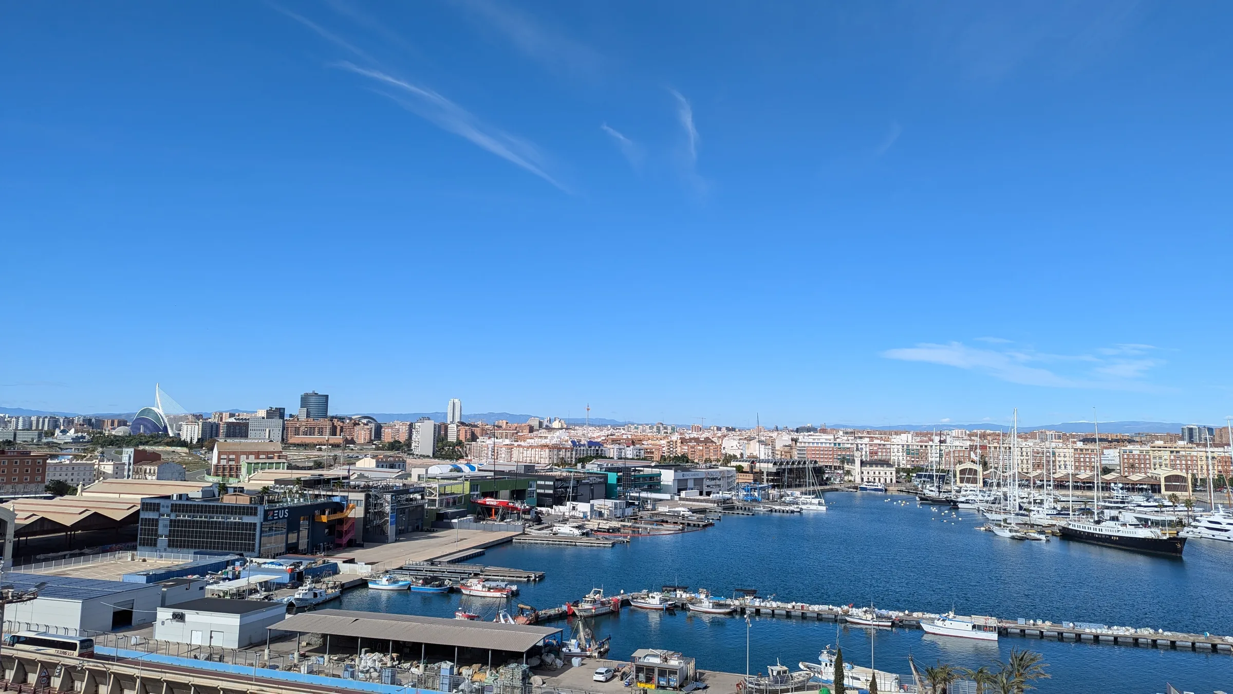 The Valencia marina and skyline seen from the harbour on a clear blue day.