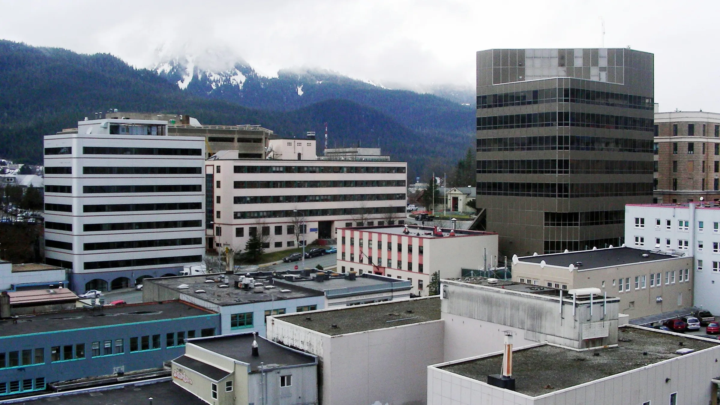 Downtown Juneau, Alaska, with mountains rising behind the waterfront buildings