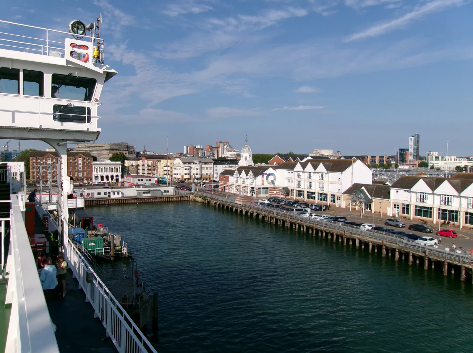 The Town Quay waterfront at Southampton with pubs and offices seen from a ferry deck.